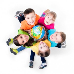 Group of kids sitting on the floor in a circle.